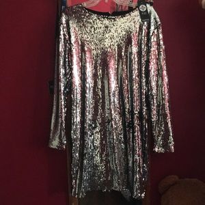 A silver sequin long sleeve dress